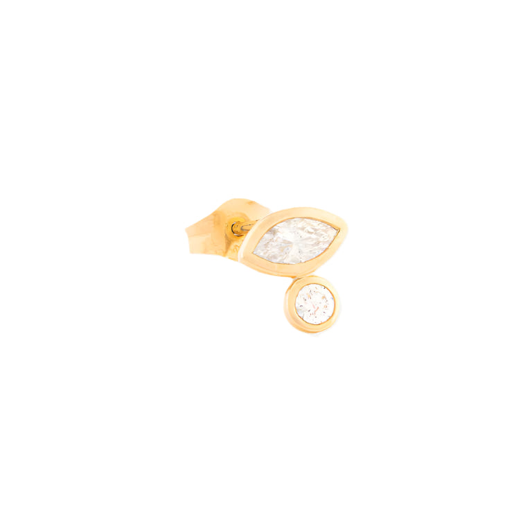 Gold earring with clear gemstones on a white background
