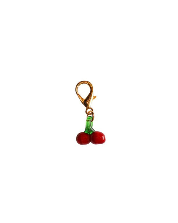 Charm with two cherries on a white background